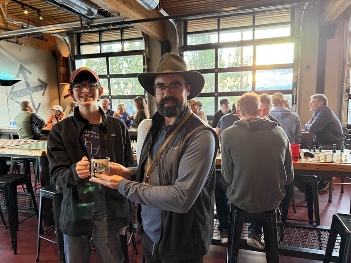 Max S receives an honorary Holiday Grand-Prix trophy from Dean C