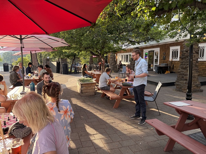 Zach C addresses the club at The Commons to present this year's Quad-Season Awards.